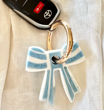 Load image into Gallery viewer, Stripey Bow Resin Keyring | Greenwood Designs