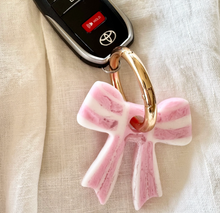 Load image into Gallery viewer, Stripey Bow Resin Keyring | Greenwood Designs